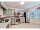 Well-lit kitchen with stainless steel appliances, ample cabinet space, and neutral countertops at 8221 Pineville Matthews Rd # G, Charlotte, NC 28226