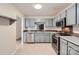 Well-equipped kitchen with stainless steel appliances and gray cabinetry at 8221 Pineville Matthews Rd # G, Charlotte, NC 28226