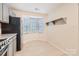 Bright kitchen nook with natural light and a view, creating a cozy dining space at 8221 Pineville Matthews Rd # G, Charlotte, NC 28226