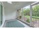 Inviting screened porch with ceiling fan, perfect for outdoor living at 8221 Pineville Matthews Rd # G, Charlotte, NC 28226