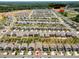 Aerial view of a neighborhood featuring many homes and the community pool and tennis courts at 9037 Remnick Dr, Gastonia, NC 28056