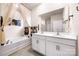Bright bathroom featuring double sinks, a soaking tub, and modern fixtures at 9037 Remnick Dr, Gastonia, NC 28056