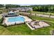 A high angle shot of the community pool, playground and lush landscaping of the neighborhood at 9037 Remnick Dr, Gastonia, NC 28056