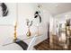 Elegant foyer featuring hardwood floors, modern art, and a stylish console table with decorative items at 9037 Remnick Dr, Gastonia, NC 28056