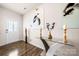 Inviting foyer with hardwood floors, decorative console table, and elegant artwork at 9037 Remnick Dr, Gastonia, NC 28056
