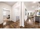 Hallway leading to laundry area with washer/dryer and access to a room with exercise equipment at 9037 Remnick Dr, Gastonia, NC 28056