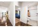 Hallway featuring hardwood floors and views of a bedroom, a bathroom and a living room at 9037 Remnick Dr, Gastonia, NC 28056