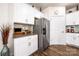 Kitchen featuring stainless steel refrigerator, white cabinets and granite countertops at 9037 Remnick Dr, Gastonia, NC 28056