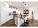 Open kitchen with granite island, stainless appliances, and bar seating at 9037 Remnick Dr, Gastonia, NC 28056