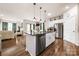 Open-concept kitchen featuring an island with granite countertops and stainless steel appliances at 9037 Remnick Dr, Gastonia, NC 28056