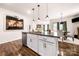 Kitchen island with granite countertops, pendant lighting, and hardwood floors at 9037 Remnick Dr, Gastonia, NC 28056
