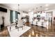 Eat-in kitchen featuring a modern island, stainless steel appliances, and hardwood flooring at 9037 Remnick Dr, Gastonia, NC 28056