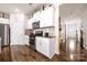 Modern kitchen with stainless steel appliances, granite countertops, and white cabinetry at 9037 Remnick Dr, Gastonia, NC 28056