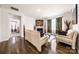 Open living room with hardwood floors, a cozy fireplace, and stylish furnishings for comfortable living at 9037 Remnick Dr, Gastonia, NC 28056