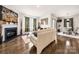 Inviting open-concept space with fireplace, hardwood floors, and seamless flow into the dining area at 9037 Remnick Dr, Gastonia, NC 28056