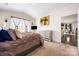 Comfortable main bedroom with a large bed, plush carpeting, and convenient access to the ensuite at 9037 Remnick Dr, Gastonia, NC 28056