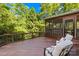 Relaxing covered back porch with seating and a screened in area at 9311 St Barts Ln, Huntersville, NC 28078