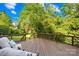 Relaxing covered back porch with seating and stairs to backyard at 9311 St Barts Ln, Huntersville, NC 28078