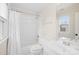 Neat bathroom with a toilet, tub with shower and a sink with a mirror at 9311 St Barts Ln, Huntersville, NC 28078