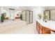A well-lit bathroom featuring a standalone shower and a soaking tub at 9311 St Barts Ln, Huntersville, NC 28078