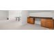 Bonus room featuring built-in desk area and neutral carpeting, offering flexible space at 9311 St Barts Ln, Huntersville, NC 28078