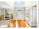 Bright foyer boasts gleaming hardwood floors, a soaring ceiling and a view through to the lush landscape at 9311 St Barts Ln, Huntersville, NC 28078