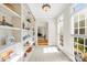 Bright hallway with built-in bookshelves and natural light from large windows at 9311 St Barts Ln, Huntersville, NC 28078