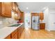 Spacious kitchen featuring wood cabinets, stainless steel appliances, and light countertops at 9311 St Barts Ln, Huntersville, NC 28078