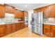 Well-lit kitchen featuring custom wood cabinets and stainless steel appliances at 9311 St Barts Ln, Huntersville, NC 28078