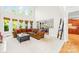 Open-concept living space with high ceilings and natural light, adjacent to the dining area and kitchen at 9311 St Barts Ln, Huntersville, NC 28078