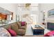 Open living area showcasing a fireplace, staircase, and connections to the kitchen at 9311 St Barts Ln, Huntersville, NC 28078
