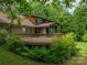 Spacious wood deck overlooking lush backyard provides room for outdoor dining and entertaining at 104 Ridge Dr, Stanley, NC 28164