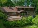 Expansive backyard featuring a large wooden deck, mature trees, and well-maintained landscaping at 104 Ridge Dr, Stanley, NC 28164