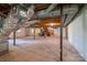 Unfinished basement featuring exposed beams and a pool table area offers great potential at 104 Ridge Dr, Stanley, NC 28164