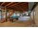 Unfinished basement with pool table and stairway could be finished for additional living space at 104 Ridge Dr, Stanley, NC 28164