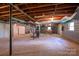 Unfinished basement with exposed utilities offers opportunity to customize and expand living space at 104 Ridge Dr, Stanley, NC 28164