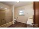 Bathroom features vinyl wood floor, single sink, toilet and shower/tub combo at 104 Ridge Dr, Stanley, NC 28164