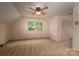 Bedroom with neutral carpet, ceiling fan, double closet, and a bright window at 104 Ridge Dr, Stanley, NC 28164