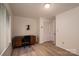 Bedroom with wood floor, desk and chair set, and double door closet at 104 Ridge Dr, Stanley, NC 28164