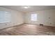 Neutral bedroom with wood-look flooring offers a blank canvas for your personal touch and decor at 104 Ridge Dr, Stanley, NC 28164