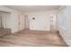 Spacious bedroom features wood-look flooring and multiple doorways for versatile living at 104 Ridge Dr, Stanley, NC 28164