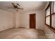 Bedroom with neutral colored carpet, ceiling fan, and natural light from the window at 104 Ridge Dr, Stanley, NC 28164