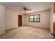 Bedroom featuring neutral carpet, a ceiling fan, and window views at 104 Ridge Dr, Stanley, NC 28164