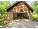 A large, open garage with brick detailing and ample space at 104 Ridge Dr, Stanley, NC 28164
