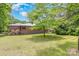 Home featuring a spacious green lawn, mature trees and landscaping at 1102 E 13Th St, Kannapolis, NC 28083