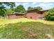 A spacious backyard view with a shed and part of the main house at 1102 E 13Th St, Kannapolis, NC 28083