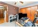 Office space features a brick accent wall, closet space, and an organized desk setup at 1102 E 13Th St, Kannapolis, NC 28083