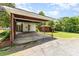 Spacious carport with brick pillars, wooden beams, and ample parking space at 1102 E 13Th St, Kannapolis, NC 28083