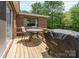 Wooden deck with table, chairs and a grill at 1102 E 13Th St, Kannapolis, NC 28083
