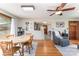 Open-concept dining area with hardwood floors, a wooden table, and easy access to the kitchen and living spaces at 1102 E 13Th St, Kannapolis, NC 28083